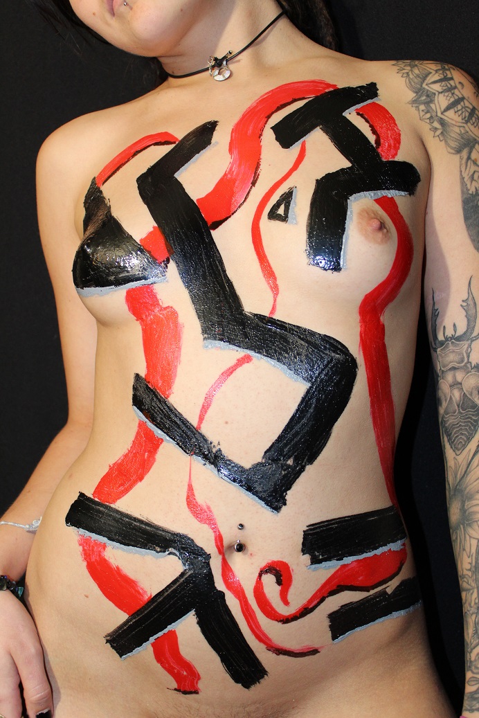 latex red and black lines on woman's torso