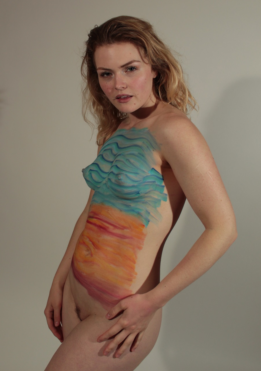 blue lines across breast, orange lines below, on woman's torso