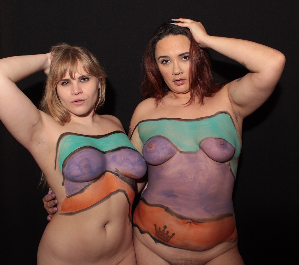 mural of horizontal colors across two female bodies: teal, purple, orange
