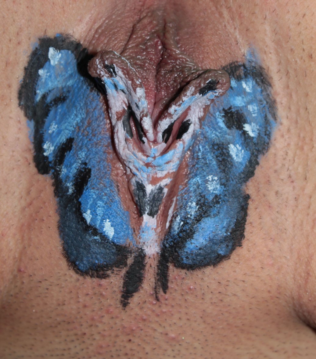 photo of blue butterfly painted on labia