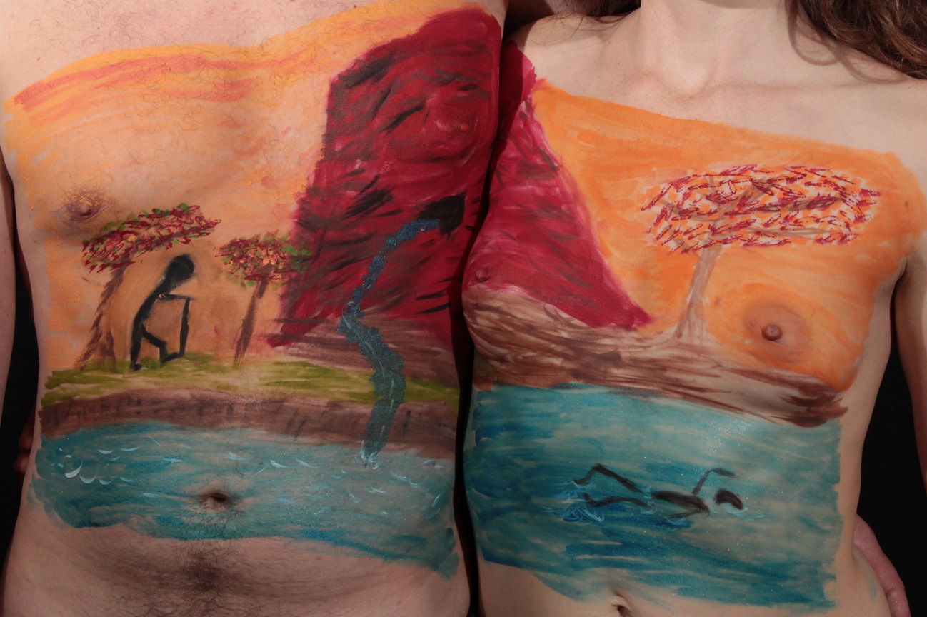 mural across a man and woman torso of river and mountains