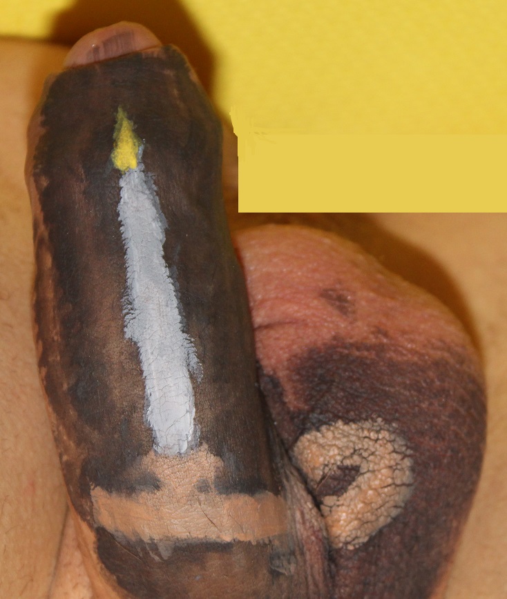 body painting on penis of candle with flame in a candlestick holder