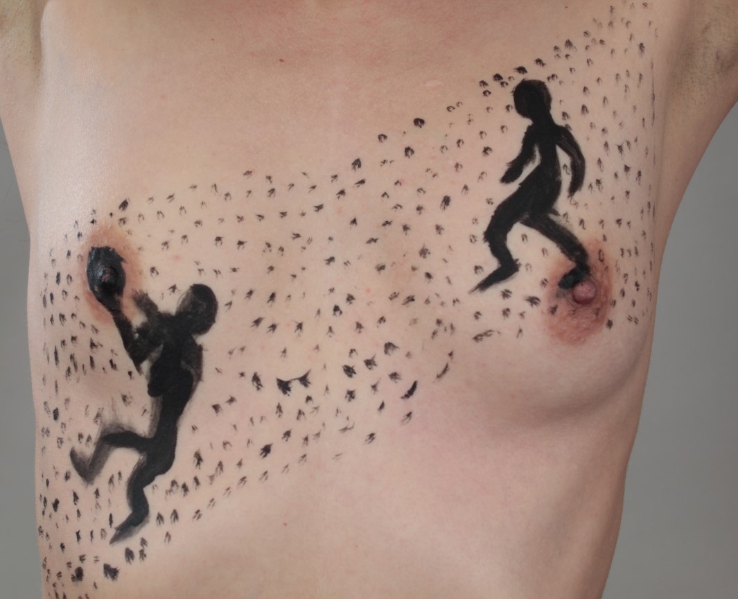 2 people playing basketball painted on woman's chest