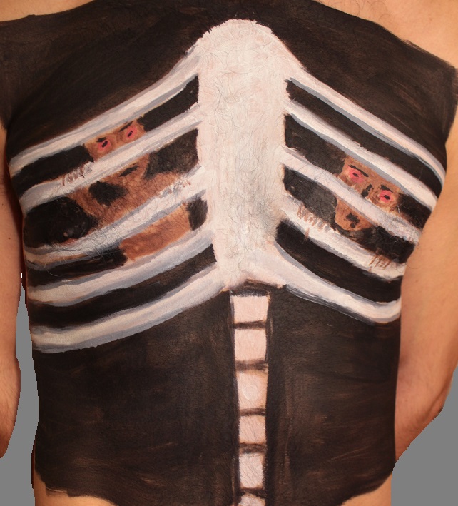 painting of ribs and spine with two alien beings trapped behind the ribcage