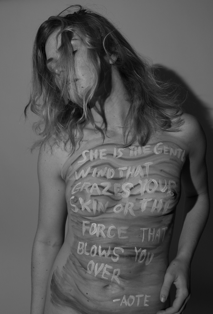 model with poem written on her torso