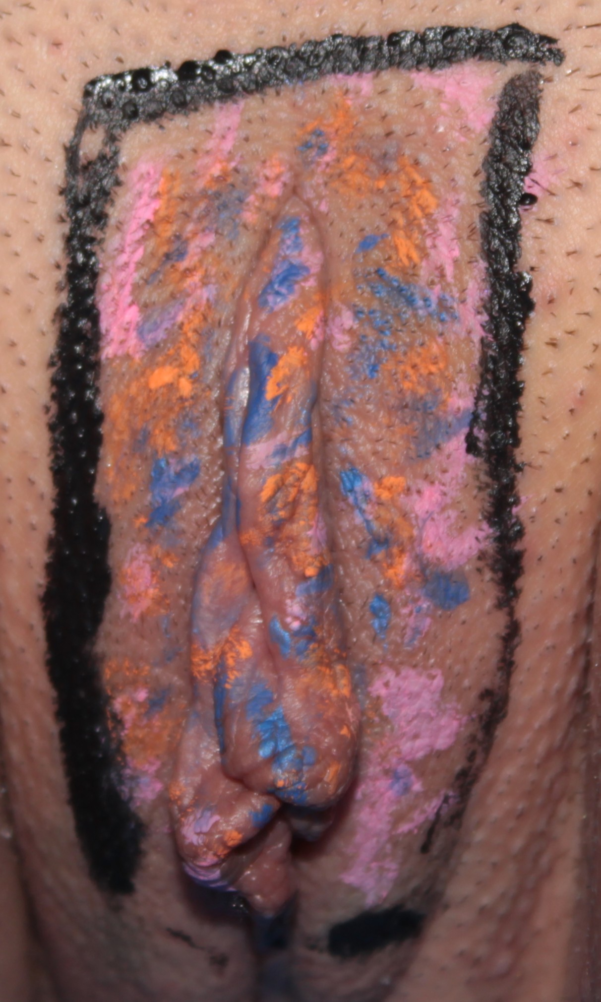 abstract colors body painted over labia.