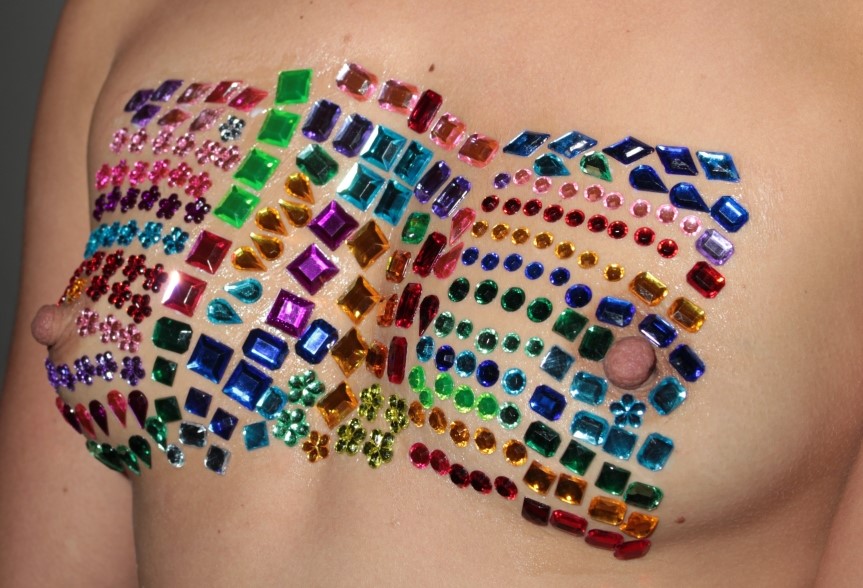body jewels decorating model's breasts