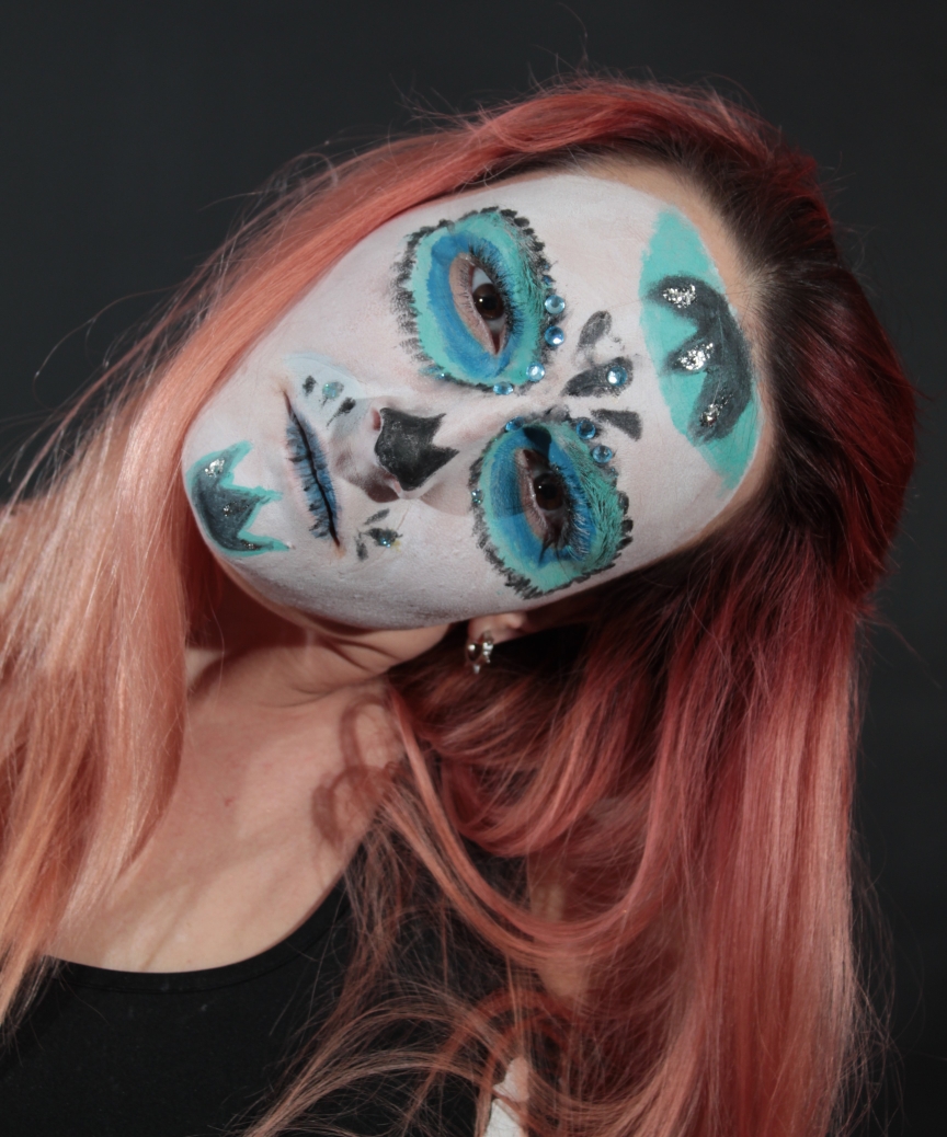 sugar skull face paint with glitter and body jewels