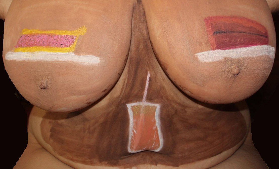 body paintings of a pie on woman's right breast, slice of cake on left breast, soda with straw on stomach