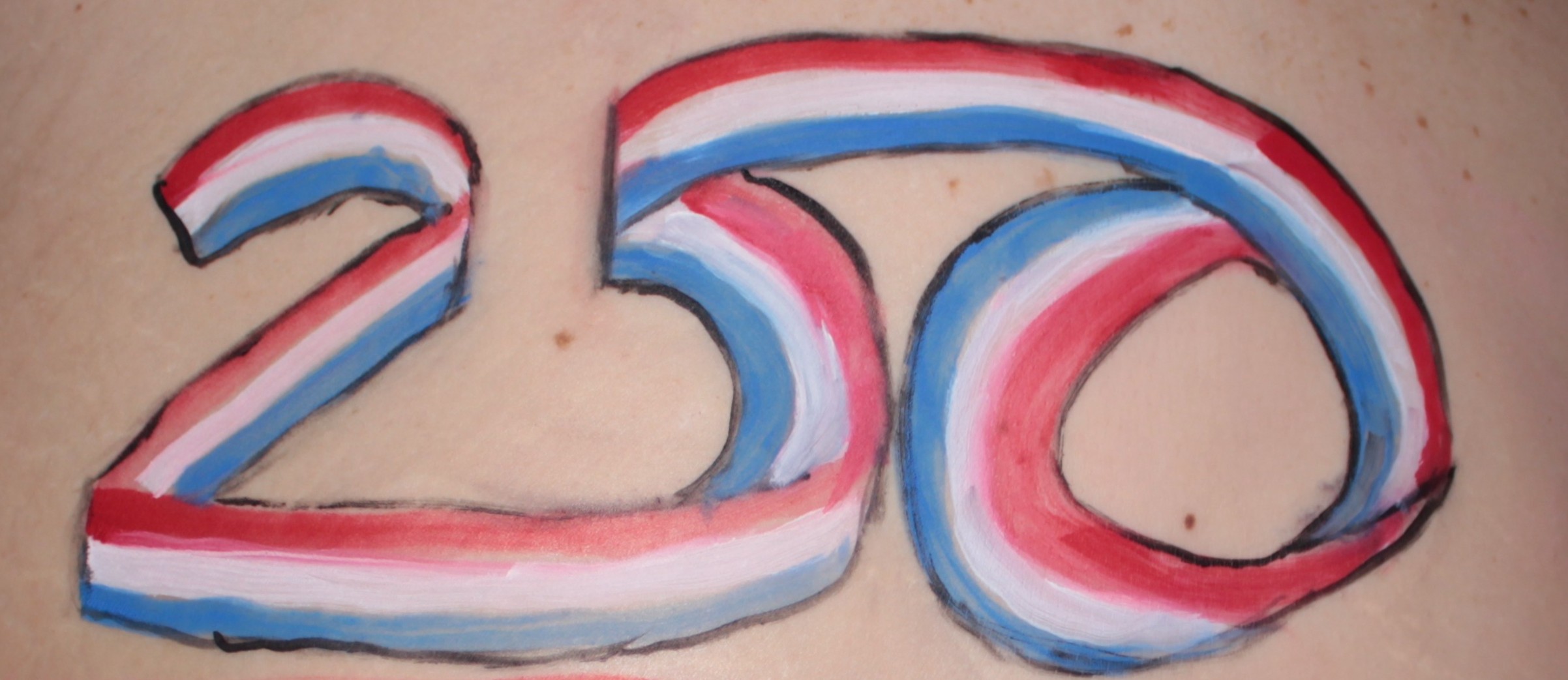 model with logo of American 250 Anniversary painted on her back
