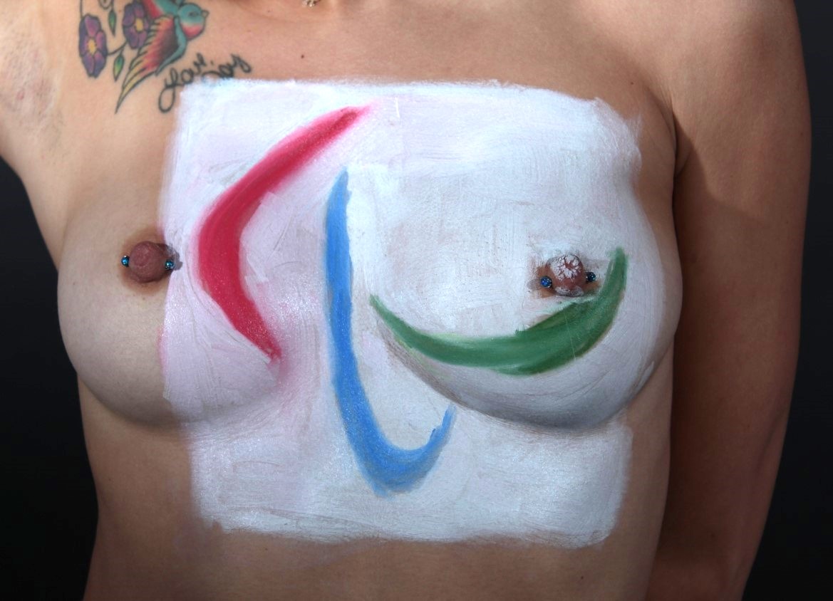 model with Paralympic Arches painted across her breasts