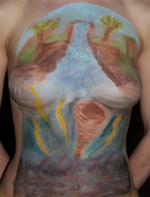 Calm river on upper chest and tornado on lower half of woman's chest