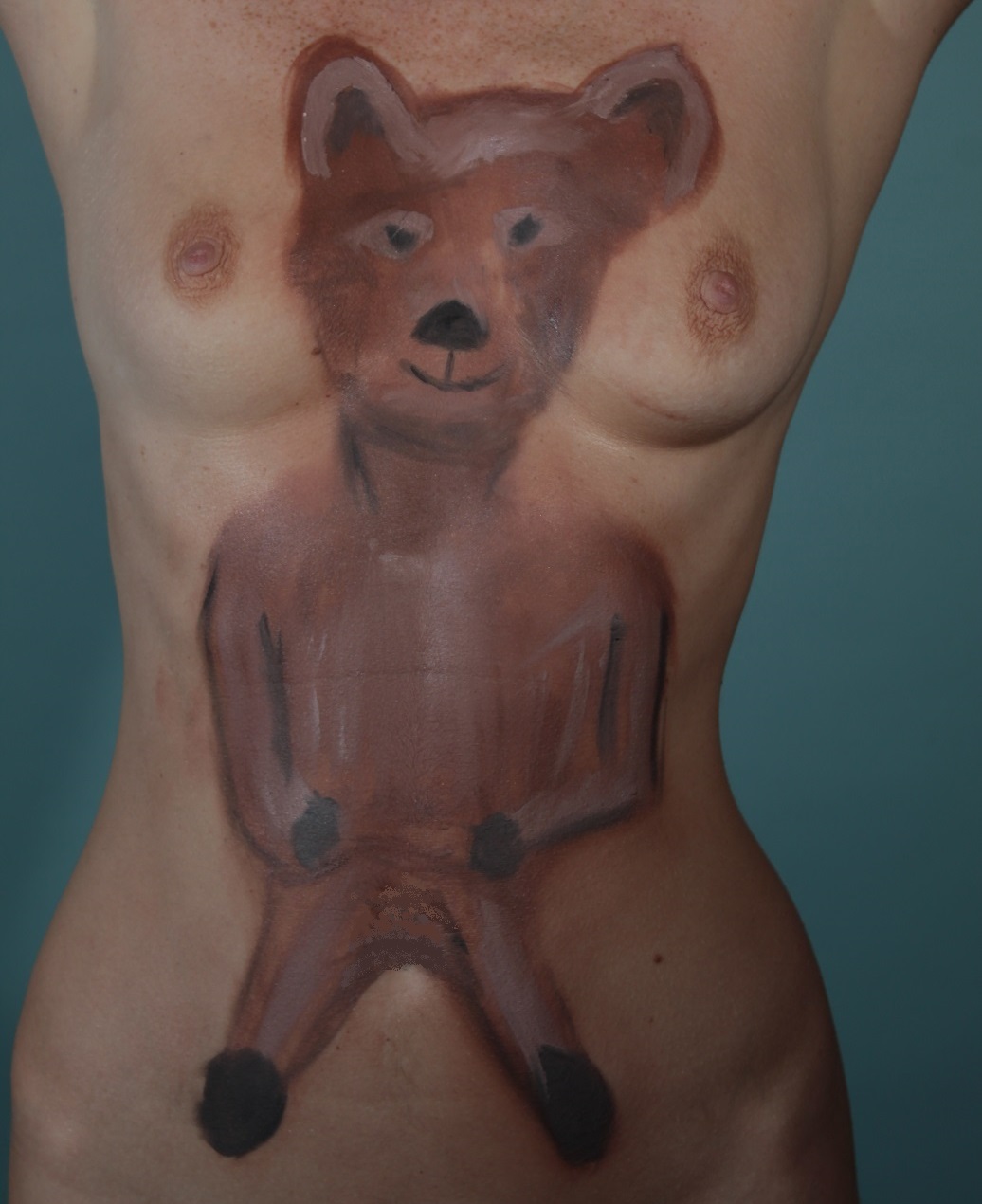 teddy bear painted on female torso