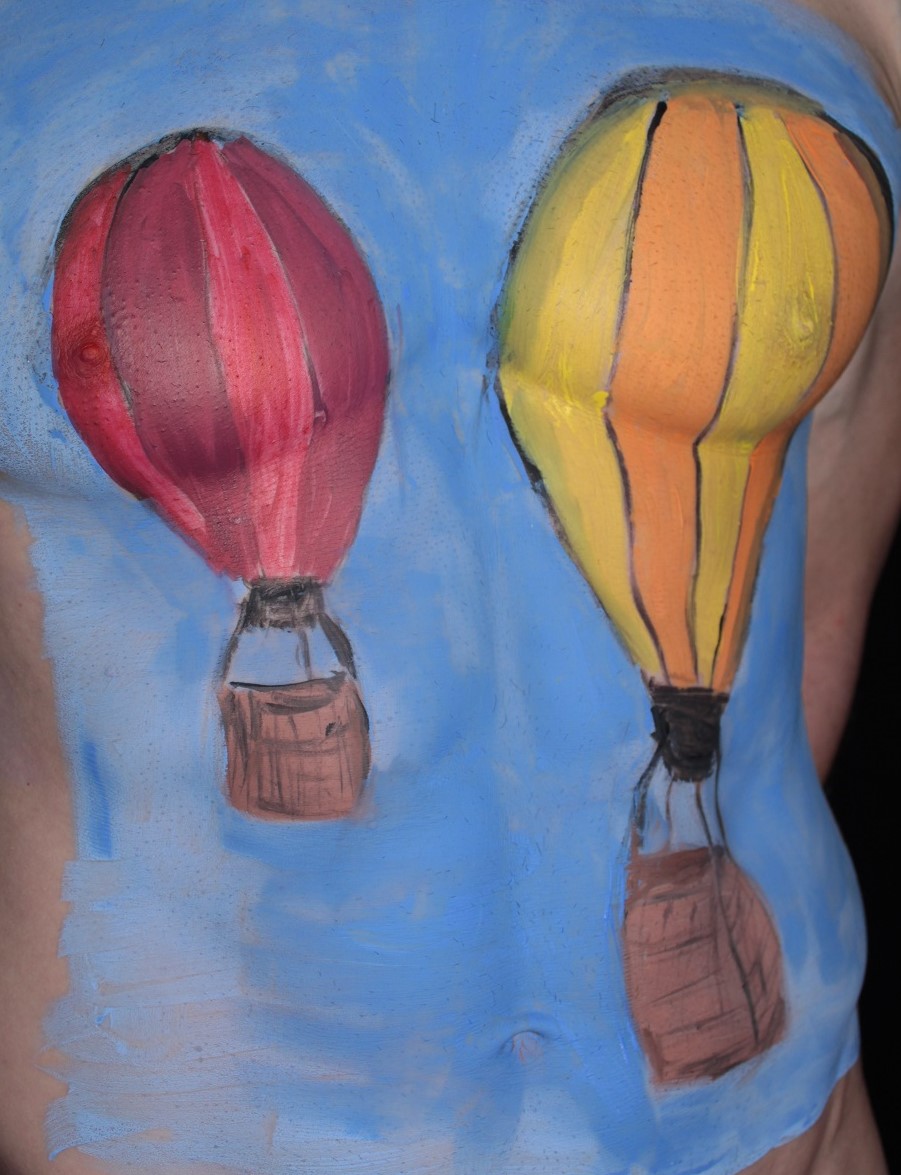 hot air balloons painted on male torso