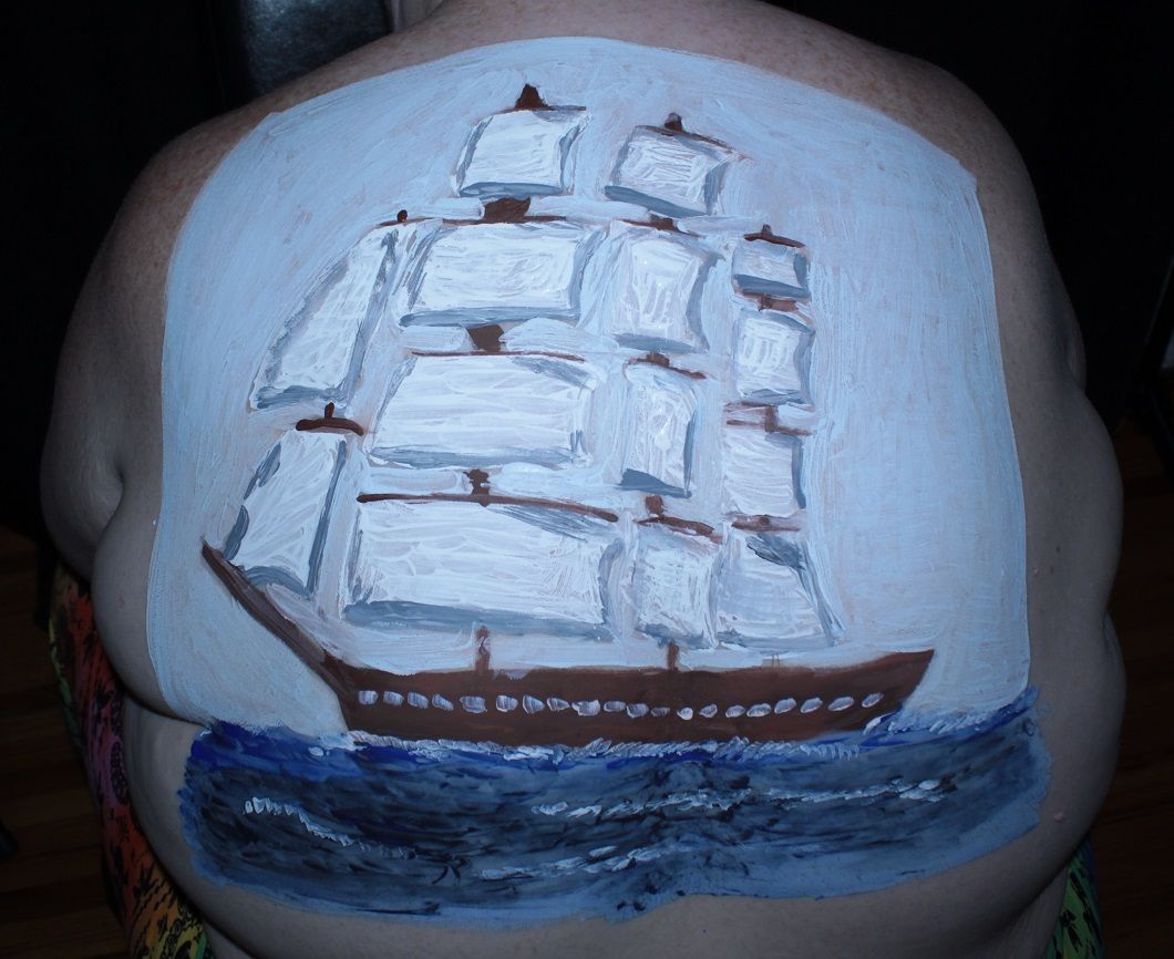 sailing ship painted on woman's back