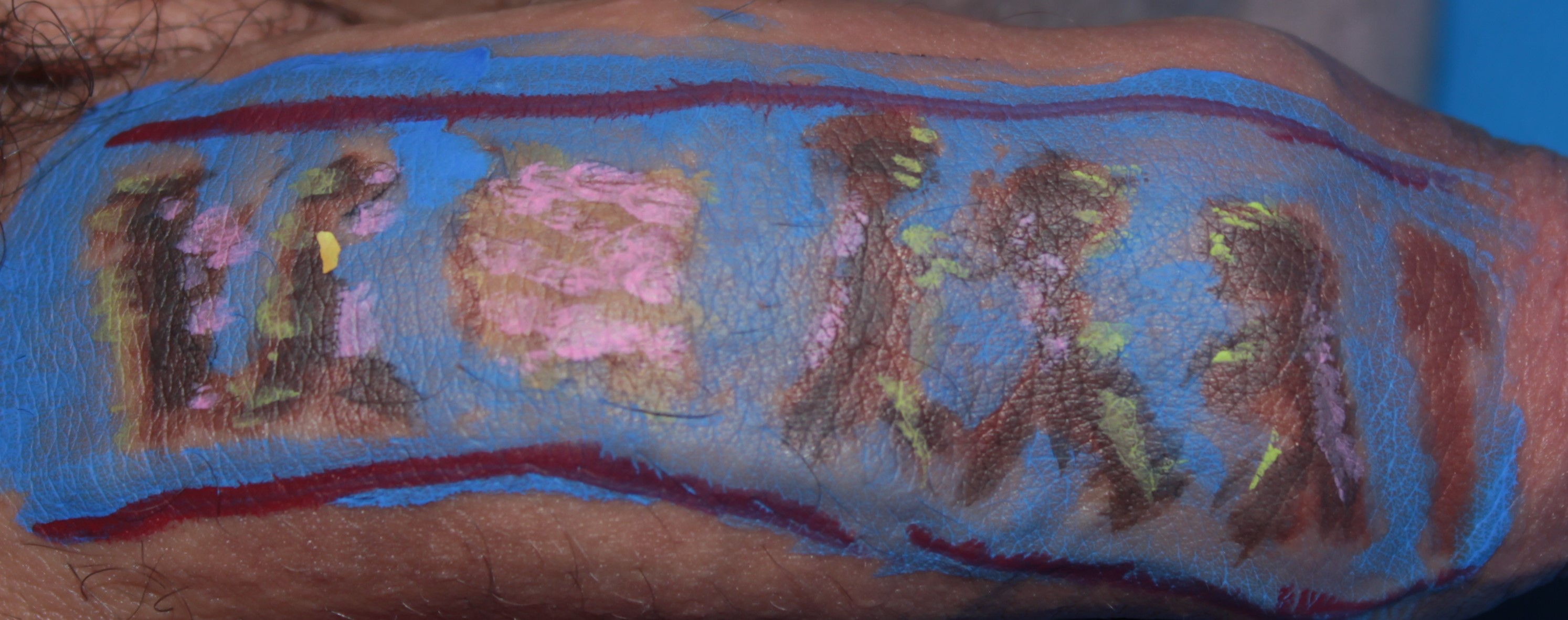 body painting on a penis of a few people standing around