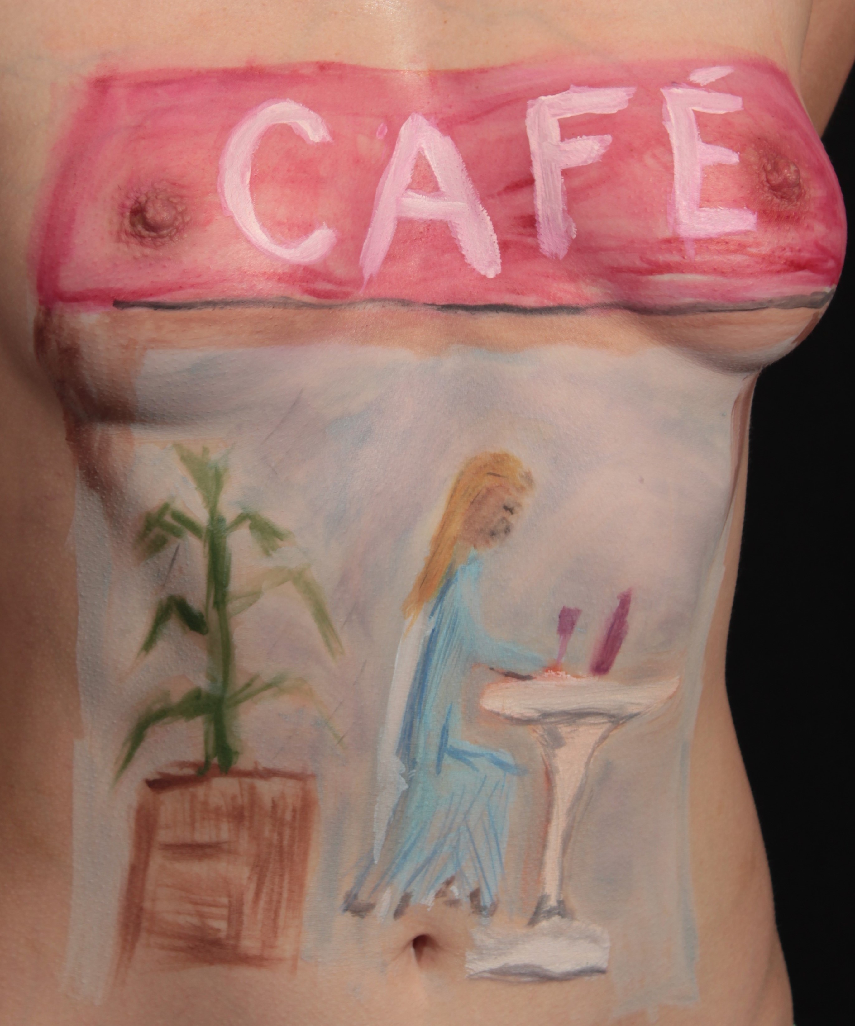 body painting of a woman at an outdoor restaurant table with a glass of wine