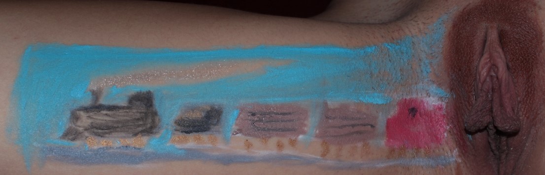 train painted on woman's inner thigh